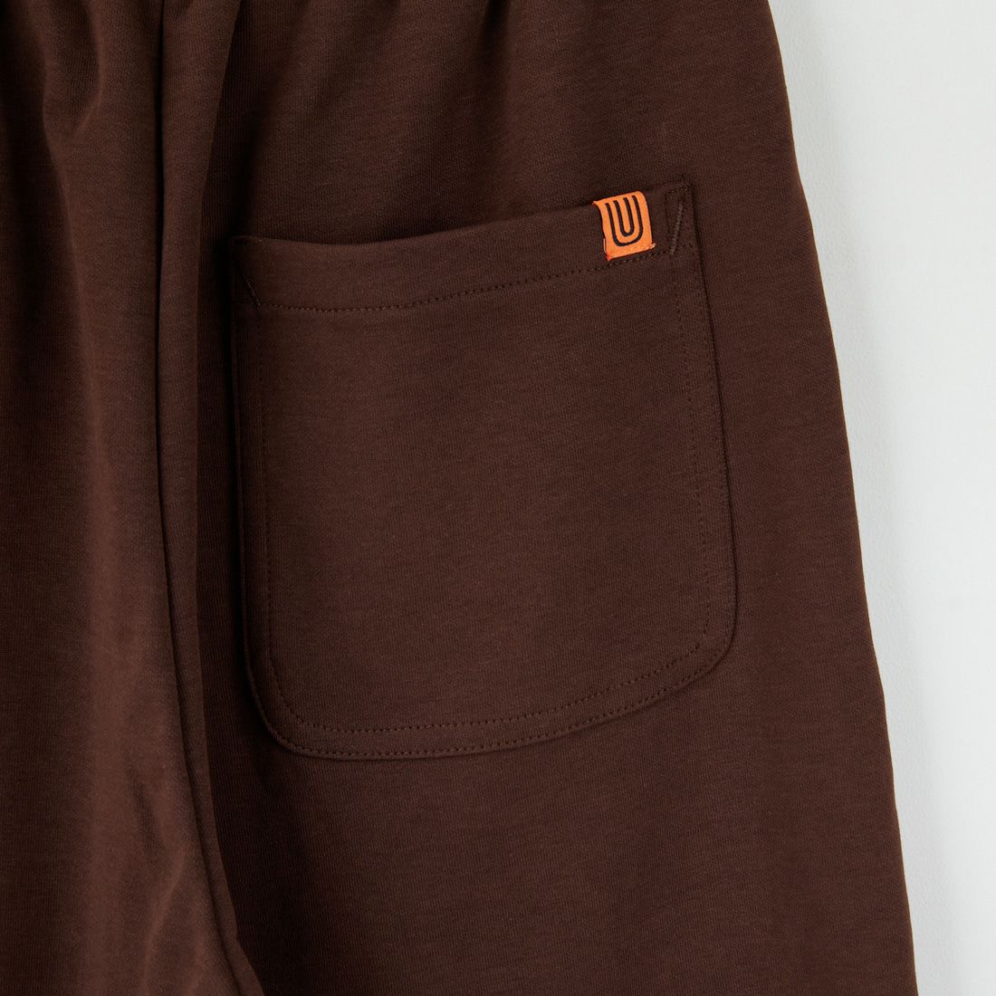 UNIVERSAL OVERALL [ユニバーサルオーバーオール] 別注 ポンチスウェットイージーパンツ [U2422601IN-JF] BROWN