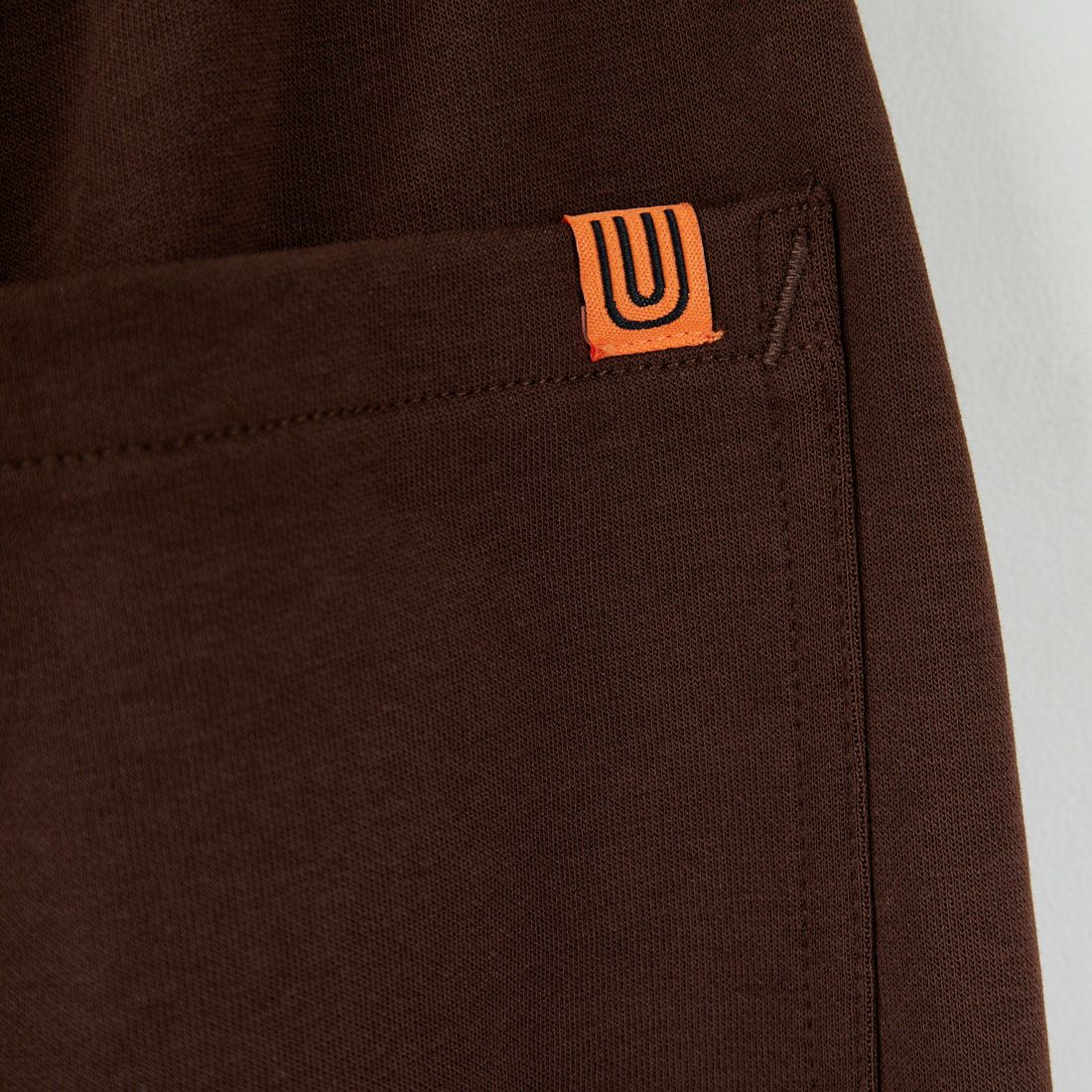 UNIVERSAL OVERALL [ユニバーサルオーバーオール] 別注 ポンチスウェットイージーパンツ [U2422601IN-JF] BROWN