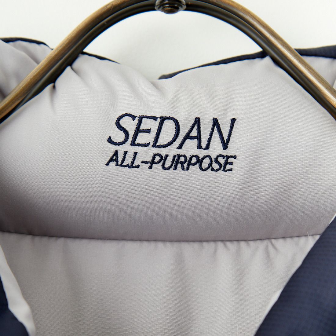 SEDAN ALL-PURPOSE [セダン オールパーパス] リバーシブルダウンベスト [SD24F-JK02] STONE/NVY