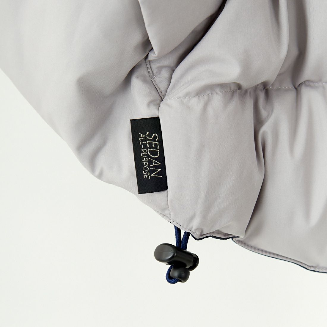 SEDAN ALL-PURPOSE [セダン オールパーパス] リバーシブルダウンベスト [SD24F-JK02] STONE/NVY