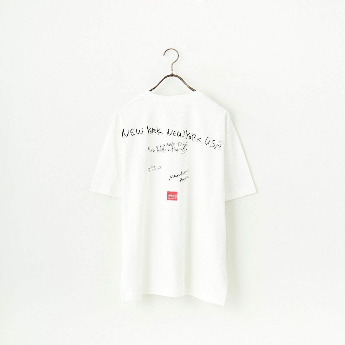 MANHATTAN PORTAGE [マンハッタンポーテージ] 別注 ランダムロゴ バックプリントTシャツ [25SSMP-IN66-JF] WHITE