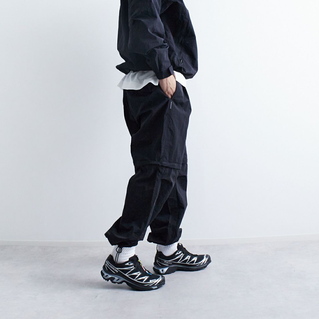 +phenix [プラスフェニックス] 別注 2WAY ナイロンタッサーコンバーチブルパンツ [POB-25007IN-JF] BLACK &&モデル身長：179cm 着用サイズ：L&&