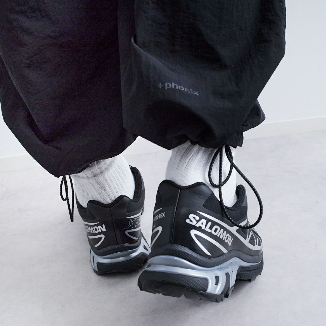 +phenix [プラスフェニックス] 別注 2WAY ナイロンタッサーコンバーチブルパンツ [POB-25007IN-JF] BLACK &&モデル身長：179cm 着用サイズ：L&&