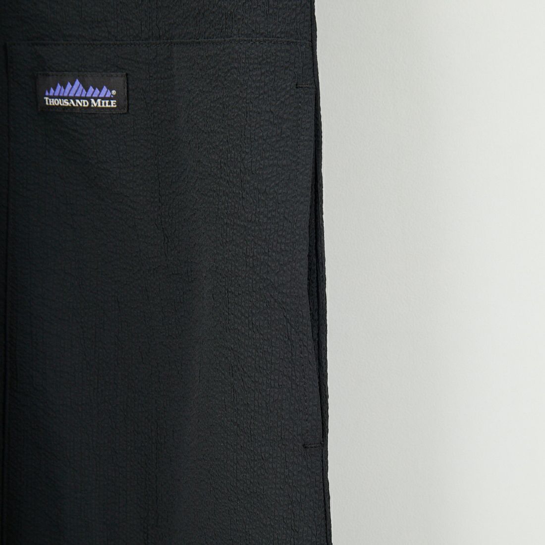THOUSAND MILE [サウザンド マイル] 別注 シアサッカーハーフジップ ノースリーブワンピース [TM251SS50962-JF] BLACK