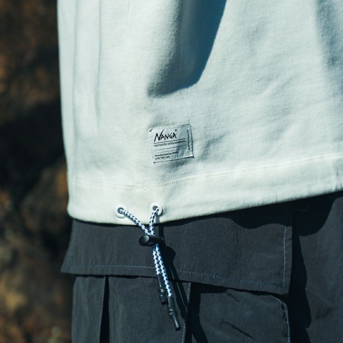 JEANSFACTORY × NANGA [ジーンズファクトリー × ナンガ] 別注 メッシュ切替え ドローコードTシャツ [NW25SS-JF7] WHITE