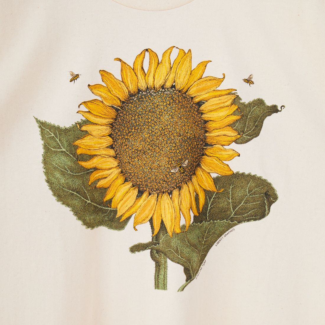LIBERTY GRAPHICS [リバティーグラフィックス] サンフラワー&ビープリントTシャツ [SUNFLOWER-AND-BEES] NATURAL