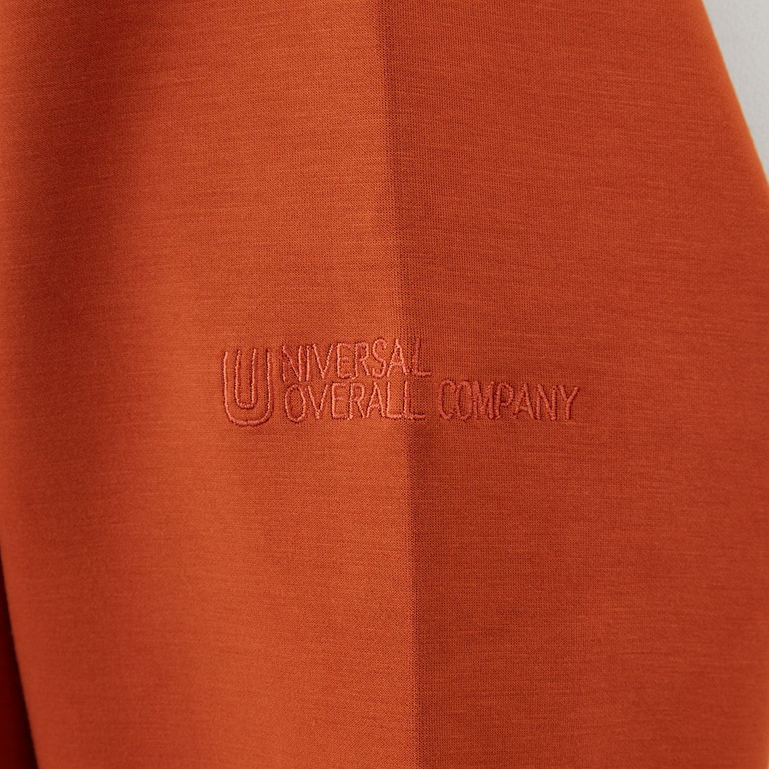 UNIVERSAL OVERALL [ユニバーサルオーバーオール] 別注 ワンポイントロゴ刺繍 ポンチ スウェットパーカー [U2531230IN-JF] ORANGE
