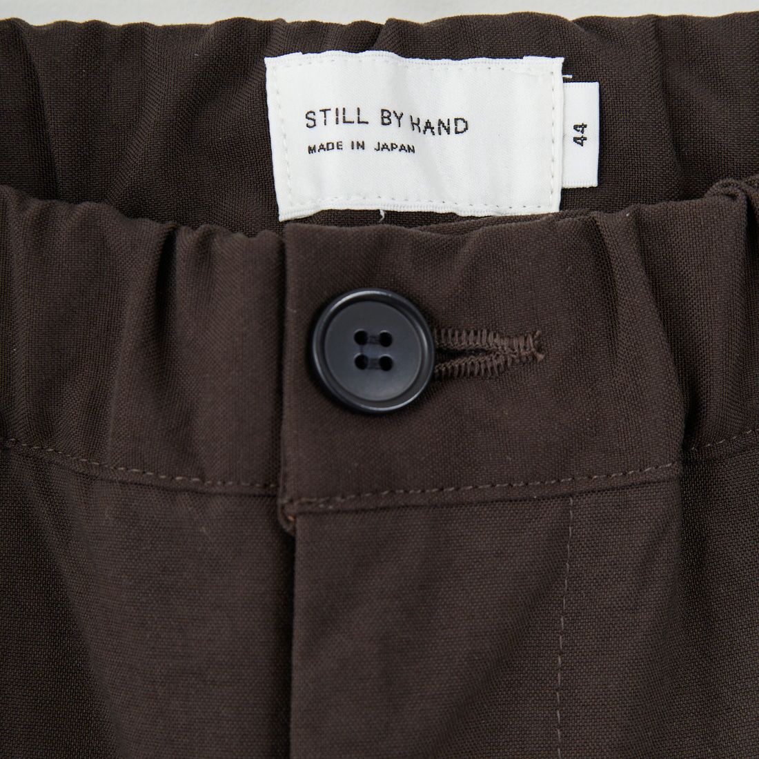 STILL BY HAND [スティルバイハンド] 別注 ナイロンオックステーパードパンツ [2503JF-EX07-JF] BROWN