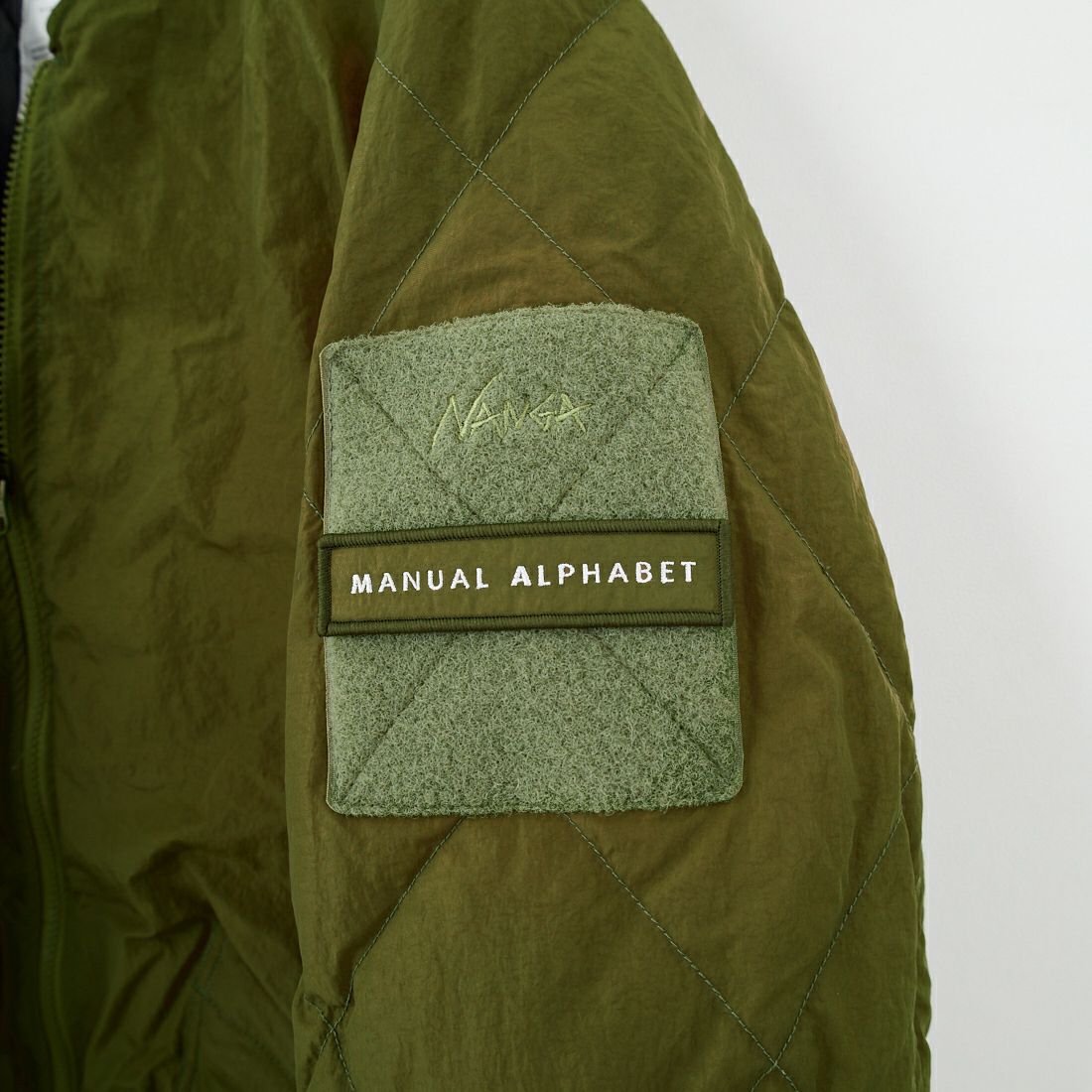 MANUAL ALPHABET × NANGA [マニュアルアルファベット × ナンガ] リバーシブル キルティングダウンコート [MA-J-377] OLIVE