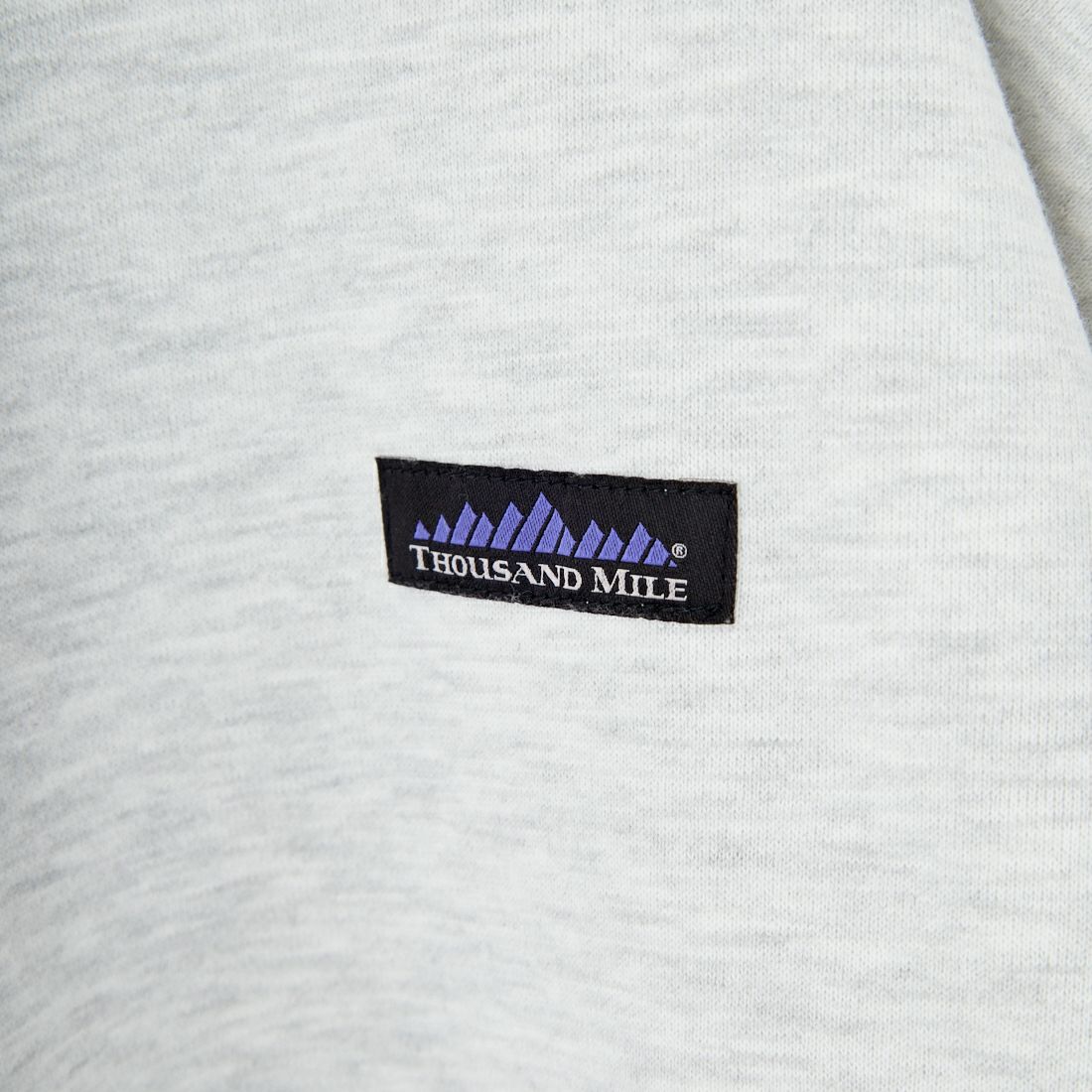 THOUSAND MILE [サウザンド マイル] 別注 ワンポイントロゴ クルーネックスウェット [TM252UK50510-JF] 11 LT.GRAY