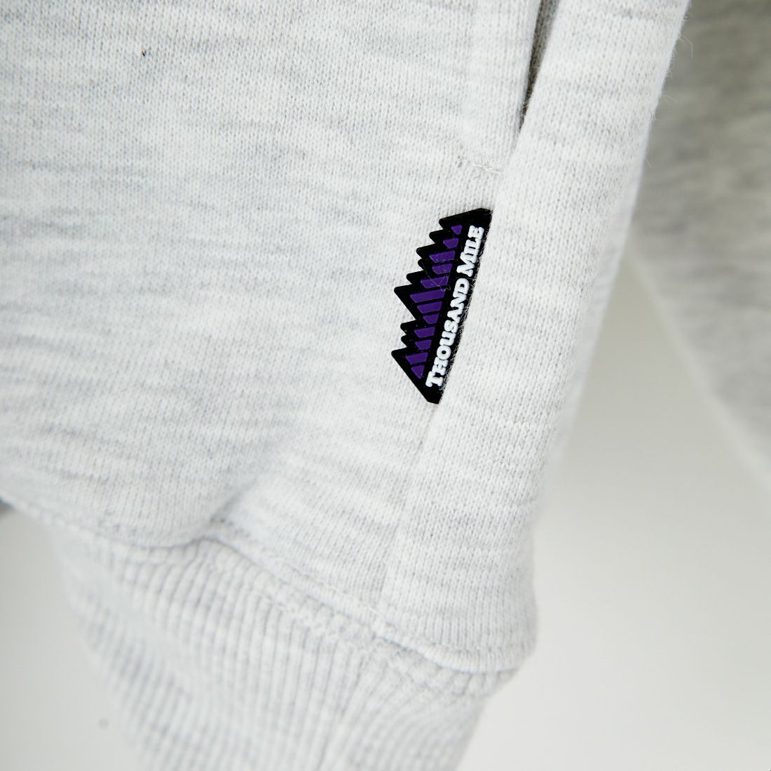 THOUSAND MILE [サウザンド マイル] 別注 ワンポイントロゴ クルーネックスウェット [TM252UK50510-JF] 11 LT.GRAY