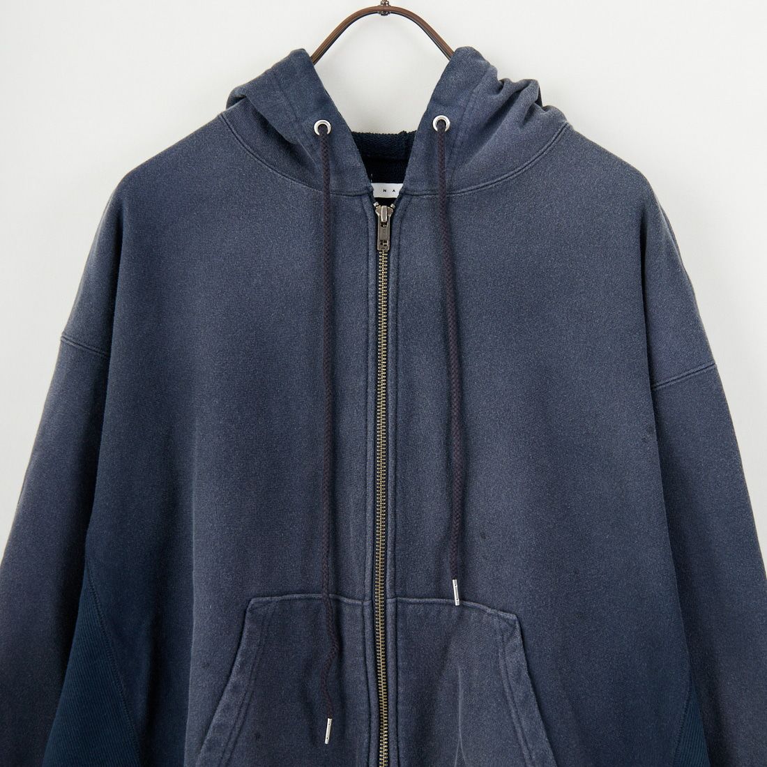 Name. [ネーム] リバーススウェットフーディ [NMCU-049] NAVY