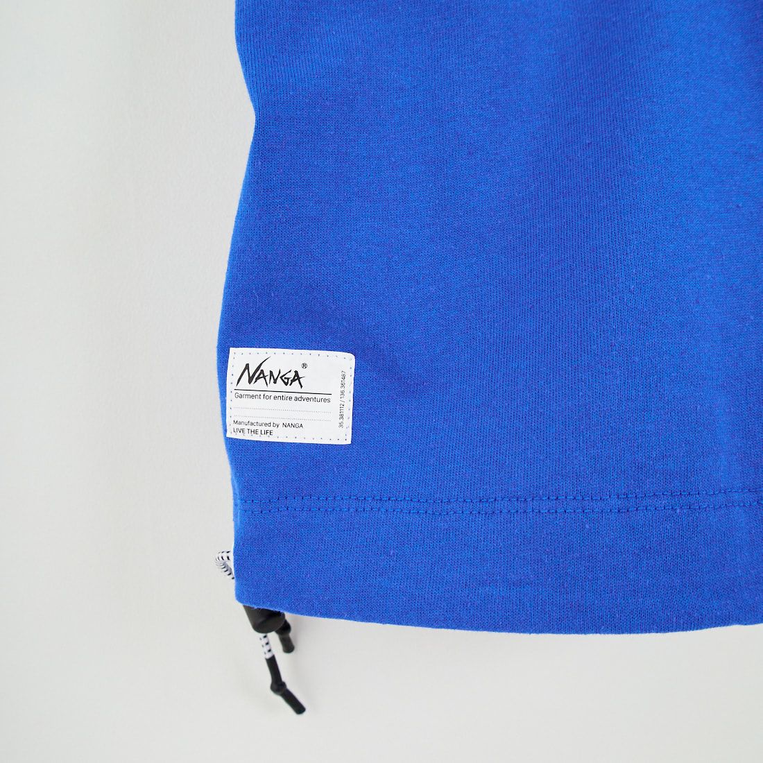 JEANSFACTORY × NANGA [ジーンズファクトリー × ナンガ] 別注 ルーズフィット スクエアロゴバックプリント ドローコードTシャツ [NW26SS-JF6] BLUE